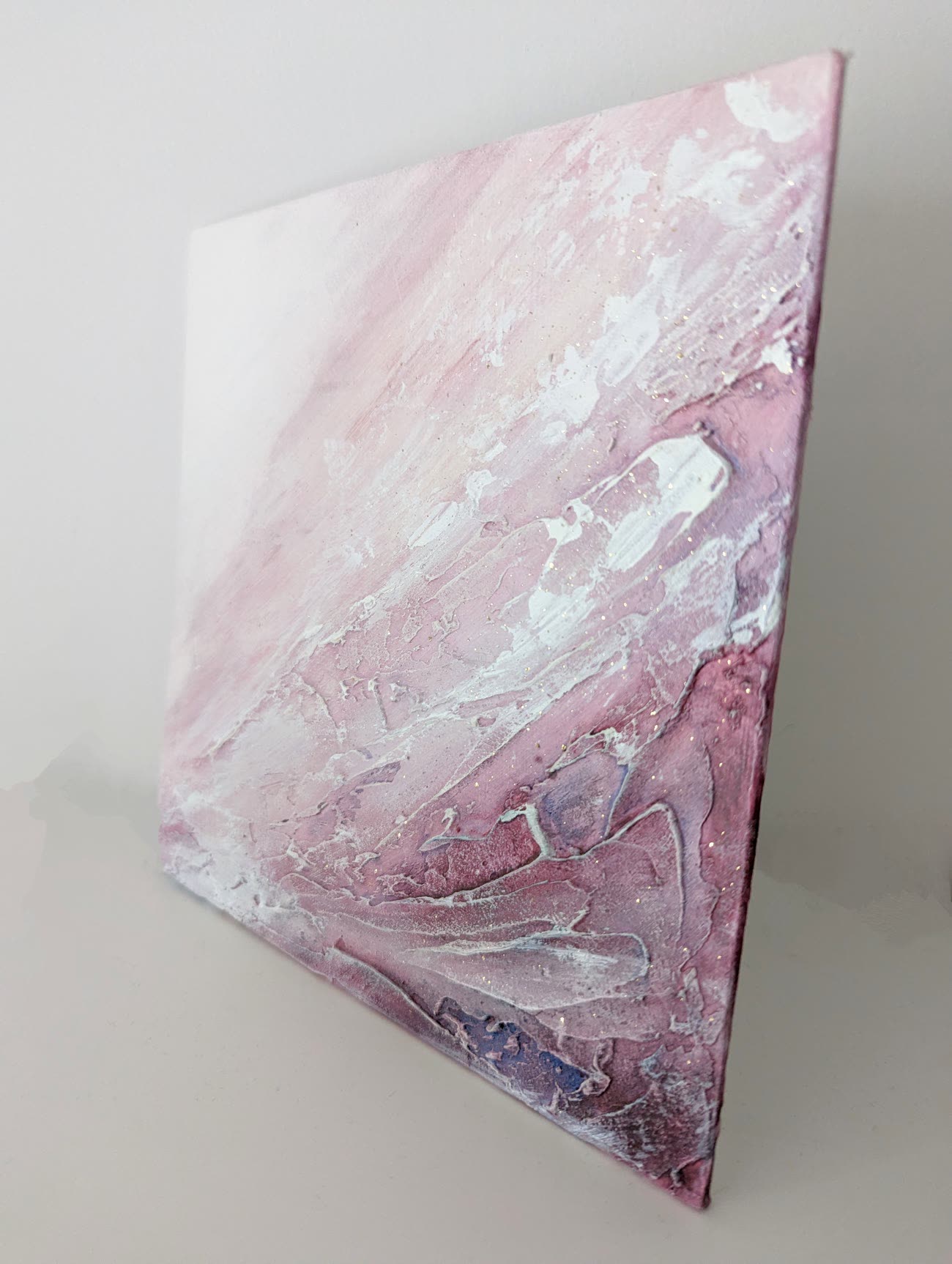 Blush — a heavily textured canvas in rose, mauve and white with glints of mica.