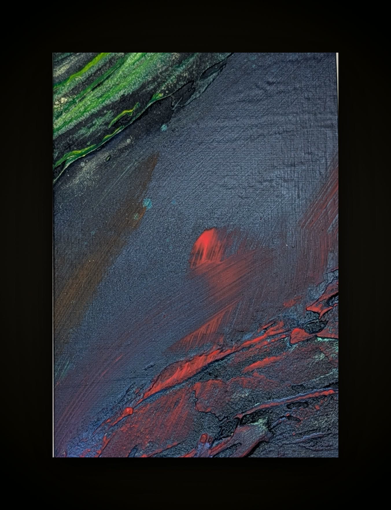 Near-black ground with a red blur above a slash of red and blue at the foot.