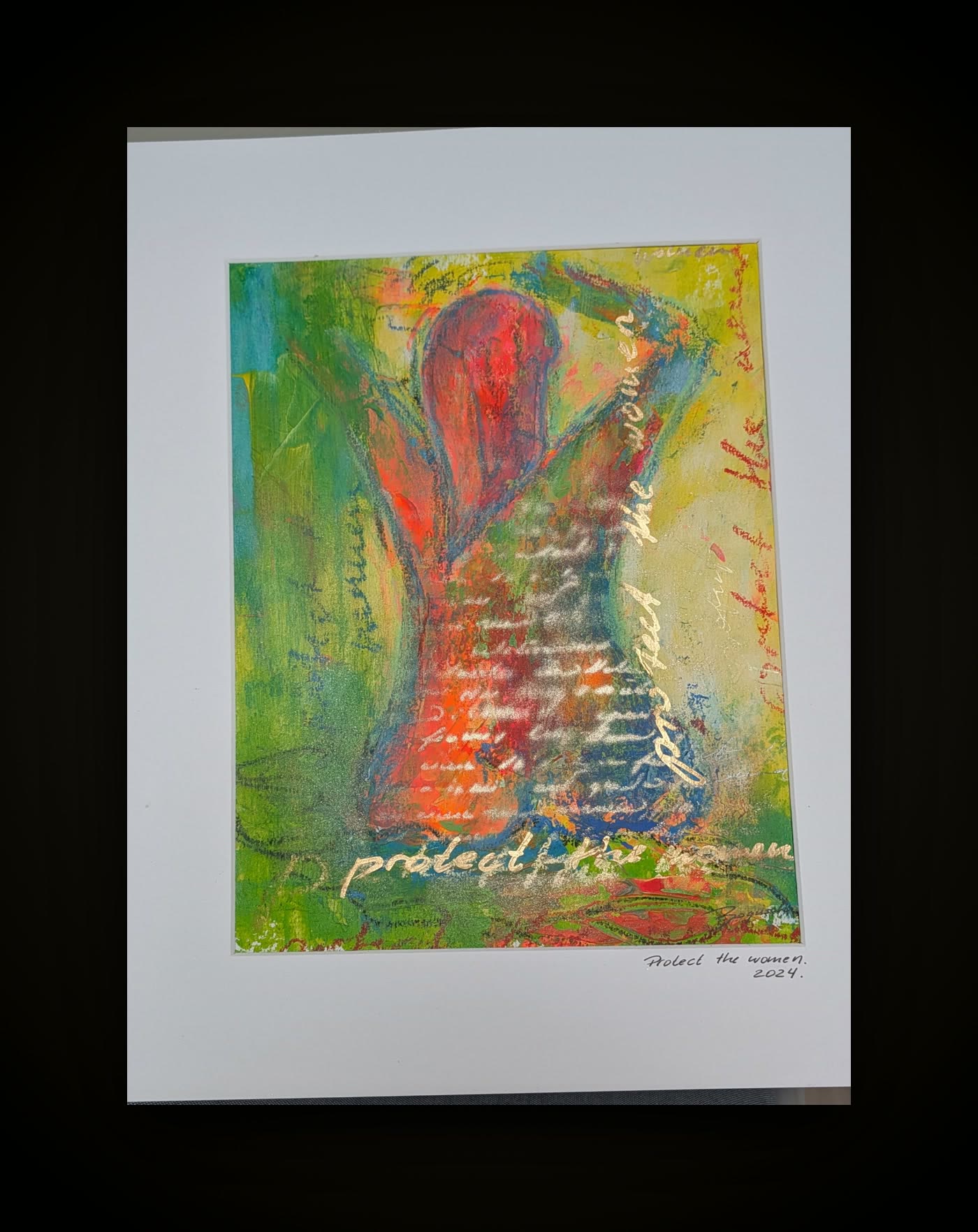 Protect the women — a mounted landscape-format work on paper in green, red and yellow with repeated handwriting.