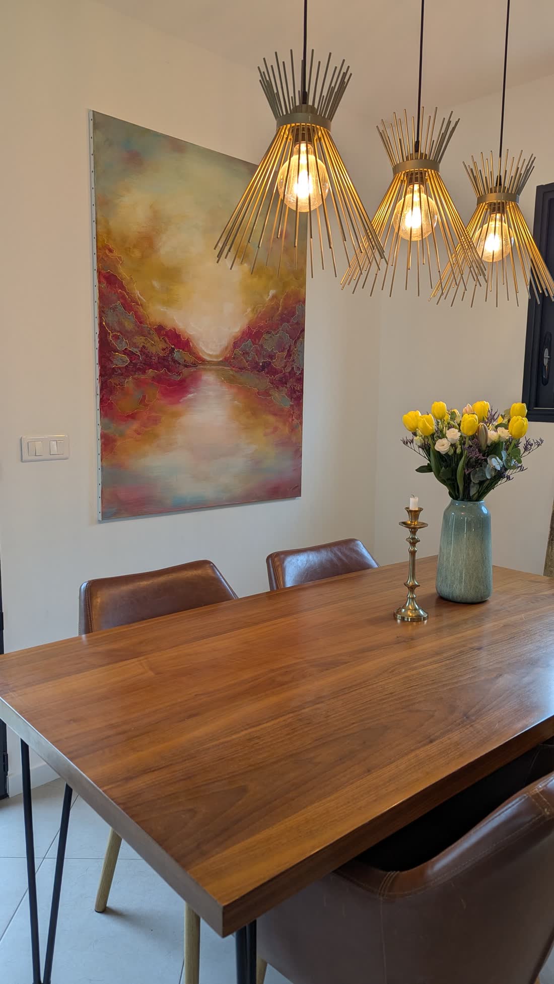 Whispering Horizon hanging above a dining table.